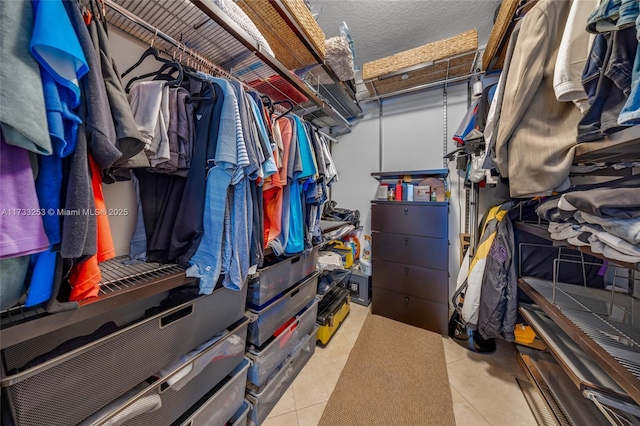 spacious closet featuring light tile patterned floors