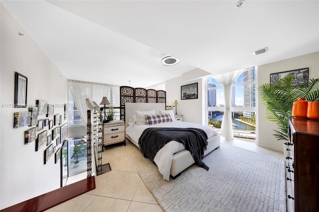 bedroom with light tile patterned floors