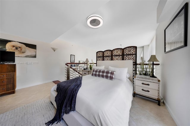 bedroom featuring light tile patterned floors