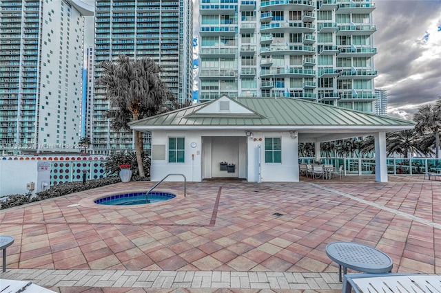 exterior space featuring a hot tub