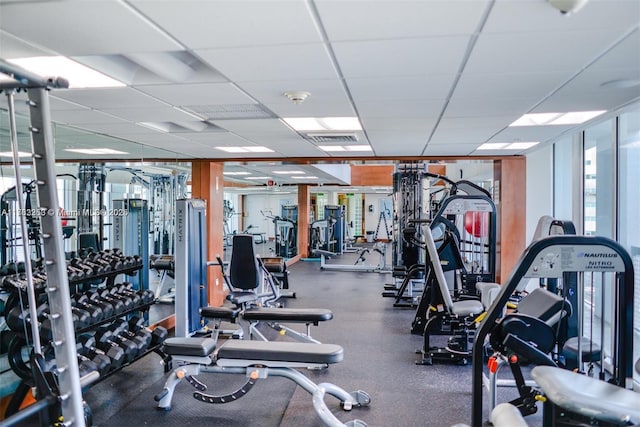 workout area with a paneled ceiling