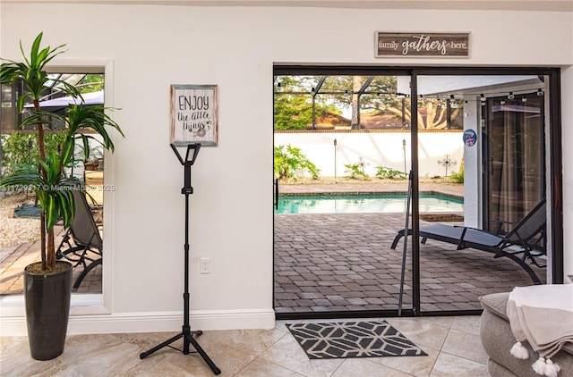 doorway with light tile patterned flooring