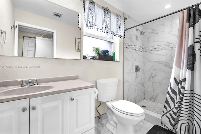 bathroom with vanity, toilet, and curtained shower