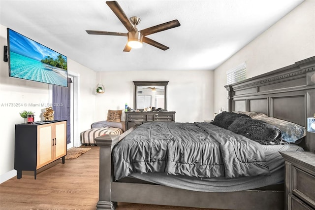 bedroom featuring ceiling fan and light wood-type flooring