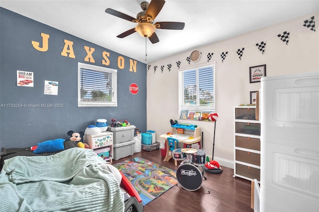 bedroom featuring dark hardwood / wood-style flooring and ceiling fan