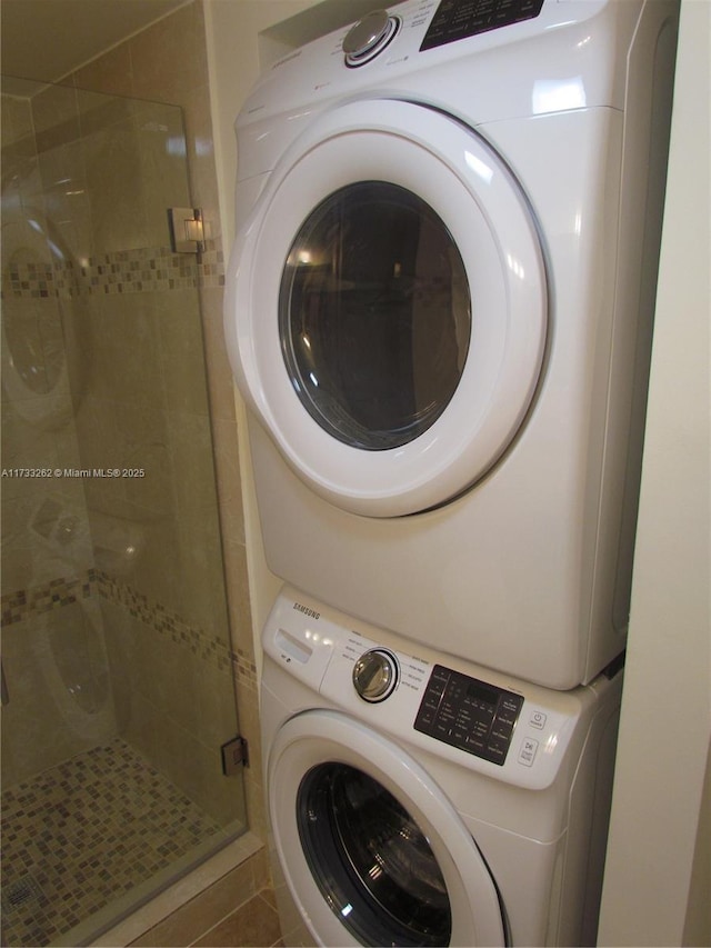 washroom with stacked washer and clothes dryer