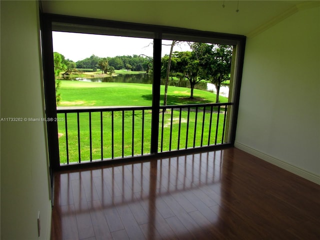 unfurnished sunroom with a water view