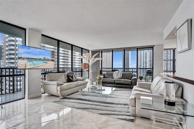 living room featuring a healthy amount of sunlight, a wall of windows, and a textured ceiling