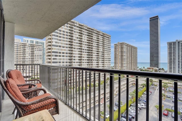 balcony featuring a water view