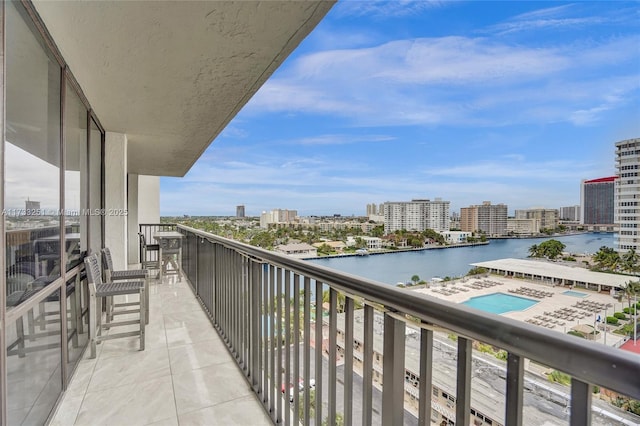 balcony featuring a water view