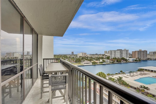 balcony featuring a water view