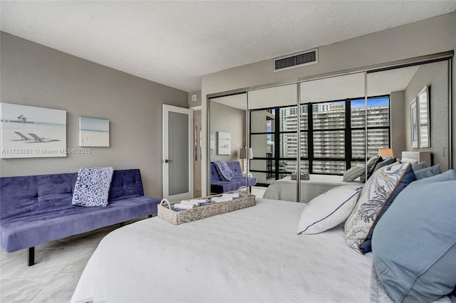 bedroom featuring a closet and a textured ceiling