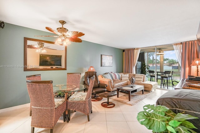 living room with floor to ceiling windows and light tile patterned floors