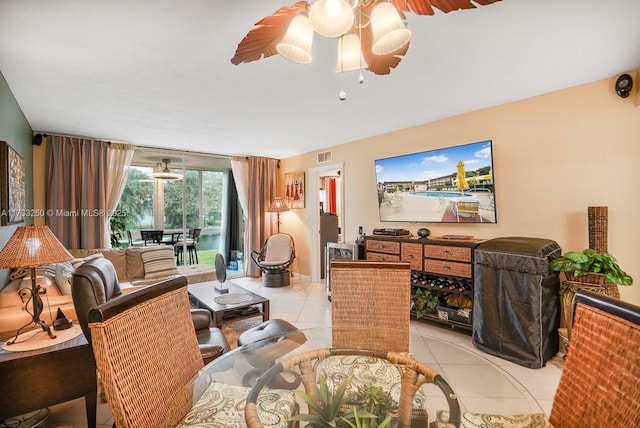 living room featuring ceiling fan and light tile patterned flooring