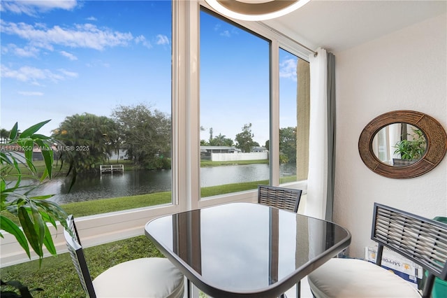 dining area featuring a water view