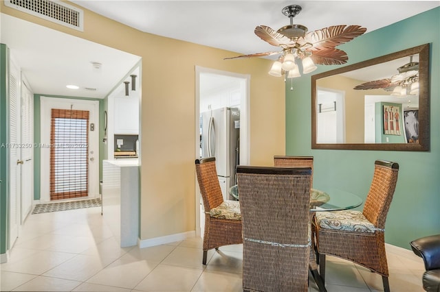 dining room featuring ceiling fan and light tile patterned floors