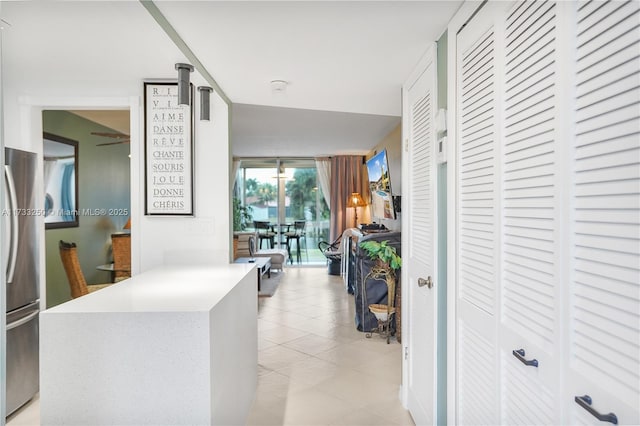 hallway with light tile patterned floors