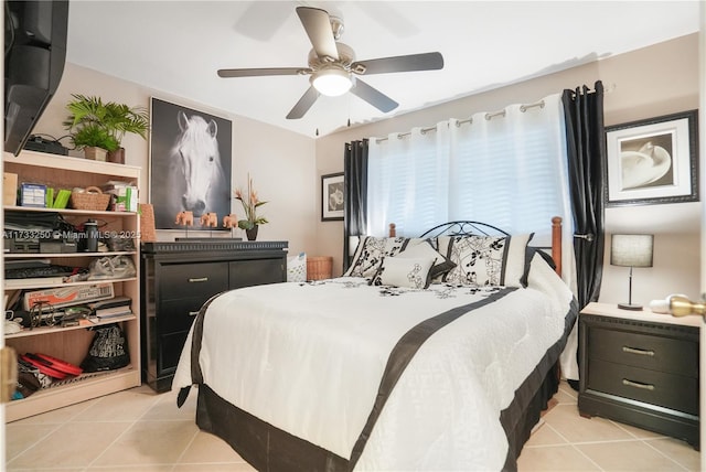 bedroom featuring light tile patterned floors and ceiling fan