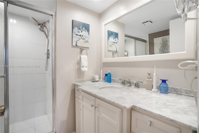 bathroom with vanity, tile patterned floors, and walk in shower