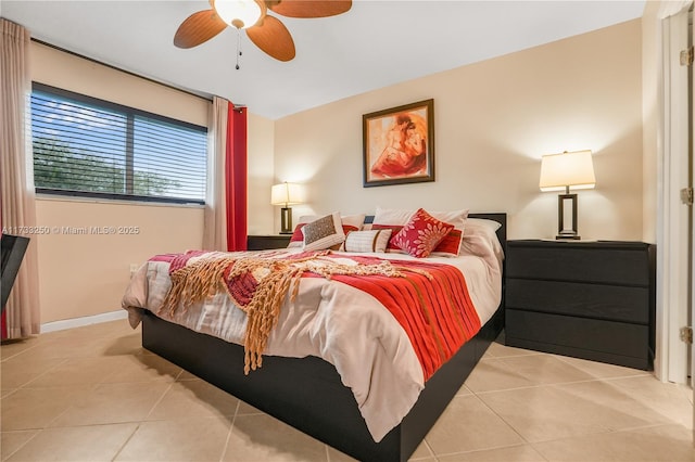 tiled bedroom with ceiling fan