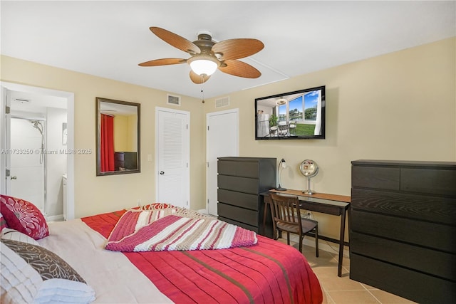 bedroom featuring light tile patterned floors, ceiling fan, and ensuite bathroom