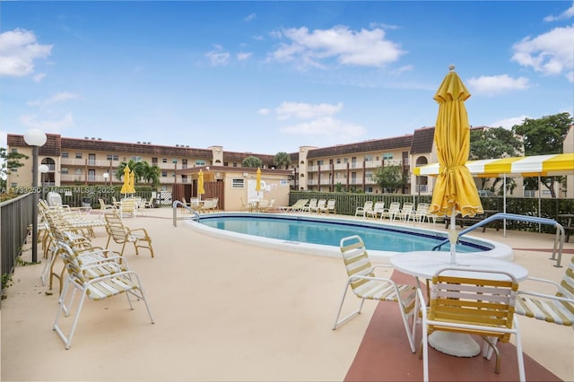 view of swimming pool with a patio area