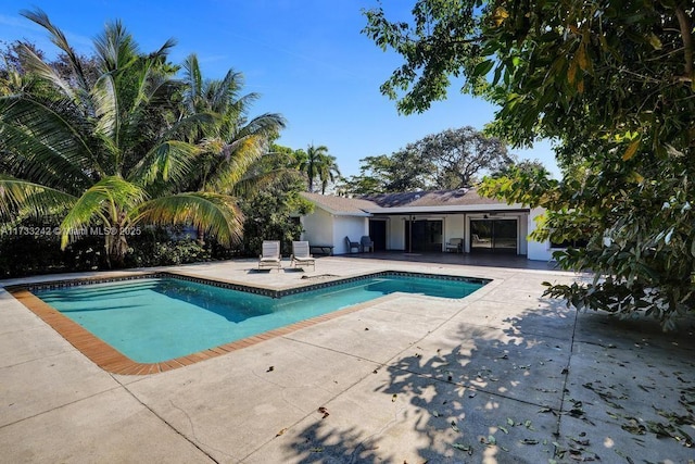 view of swimming pool with a patio