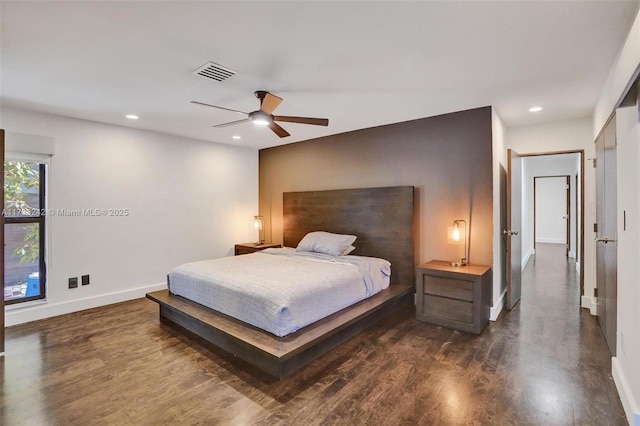 bedroom featuring ceiling fan and dark hardwood / wood-style flooring