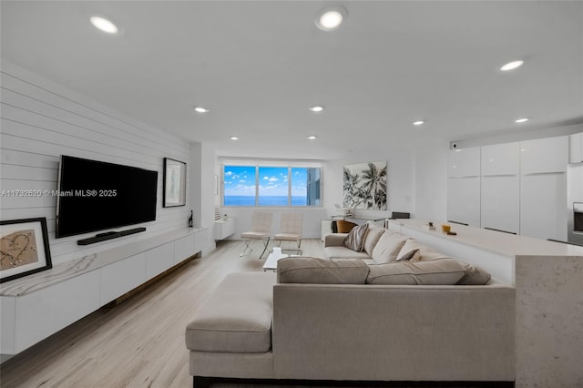 living room with light hardwood / wood-style flooring