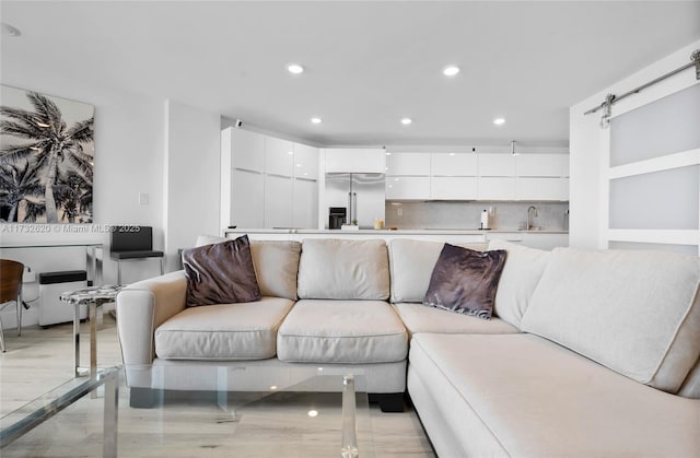 living room featuring a barn door