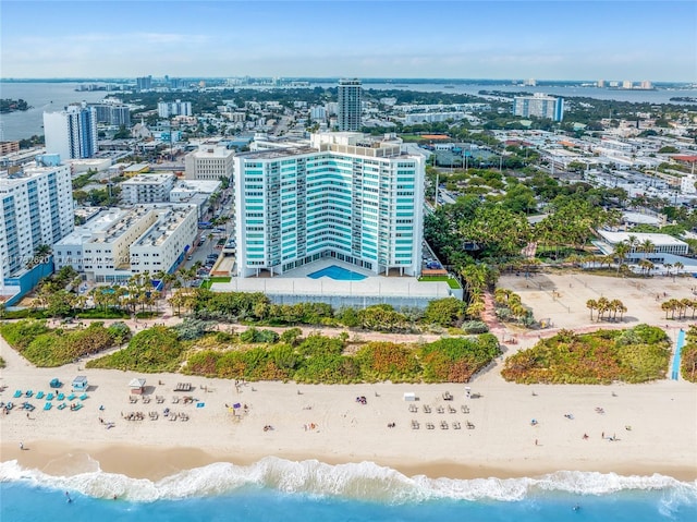 drone / aerial view featuring a view of the beach and a water view