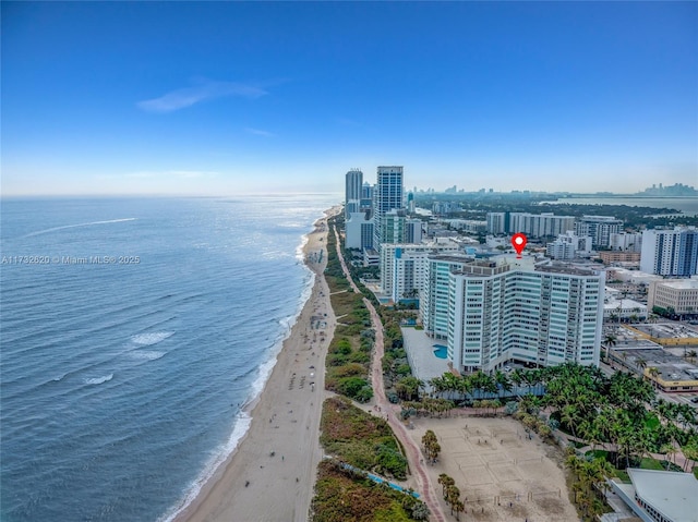 aerial view with a water view and a view of the beach