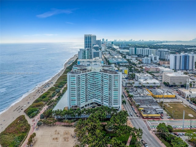 drone / aerial view with a view of the beach and a water view