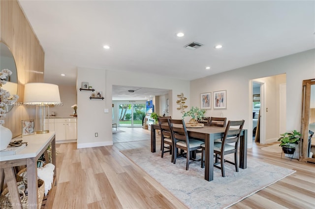 dining area with light hardwood / wood-style floors