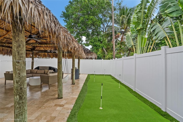 view of patio featuring an outdoor hangout area and ceiling fan