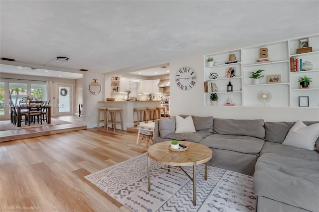 living room with light hardwood / wood-style floors