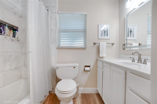 full bathroom featuring hardwood / wood-style flooring, shower / tub combo with curtain, vanity, and toilet