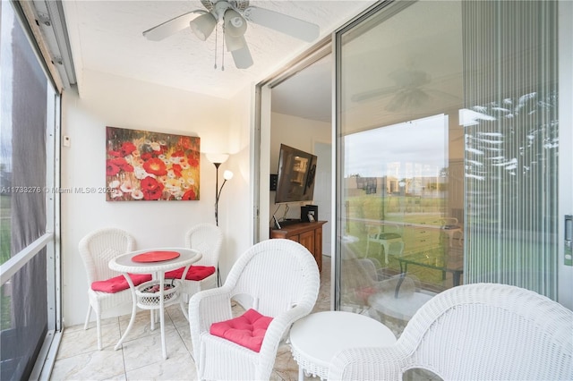 sunroom / solarium with ceiling fan