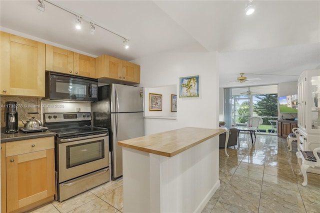 kitchen featuring butcher block countertops, ceiling fan, stainless steel appliances, decorative backsplash, and light brown cabinets