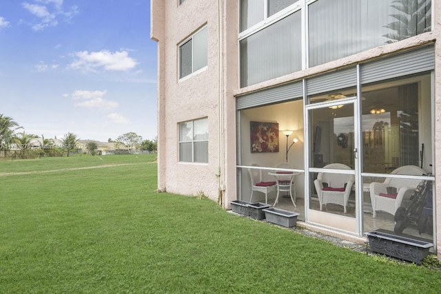 view of home's exterior with a lawn