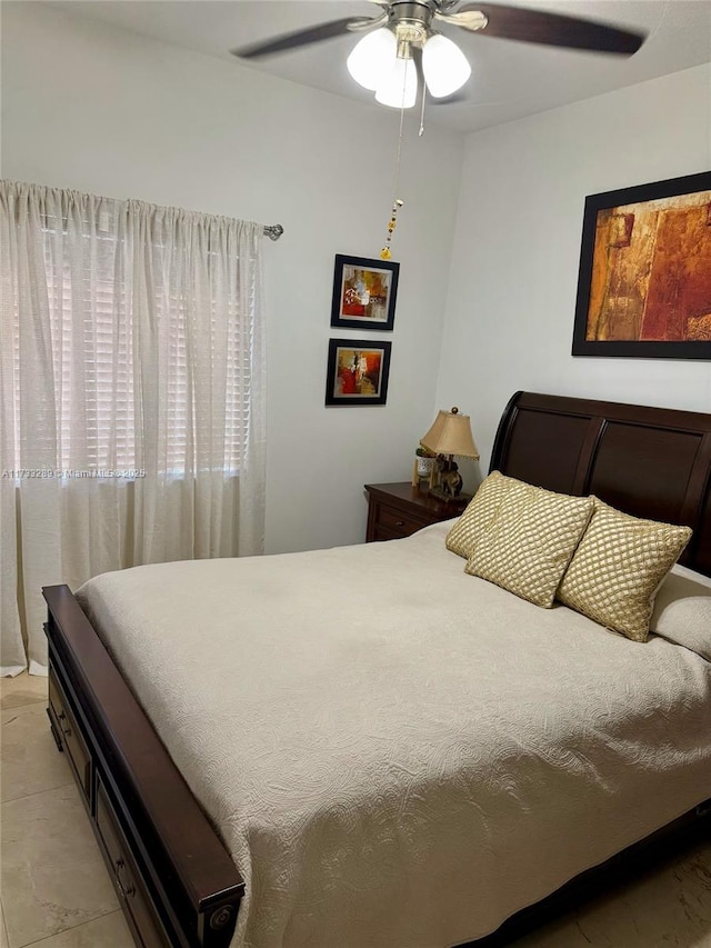 tiled bedroom with ceiling fan