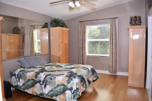 tiled living room with ornamental molding, ceiling fan, and a textured ceiling