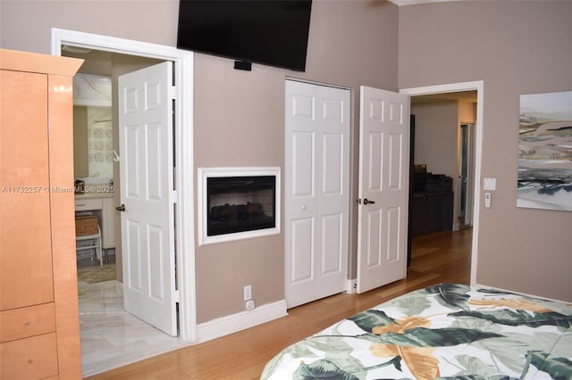 bedroom with hardwood / wood-style floors