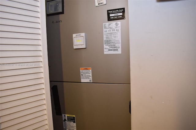 utility room with heating unit