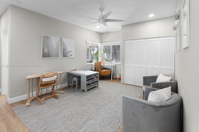 home office with recessed lighting, wood finished floors, a ceiling fan, and baseboards