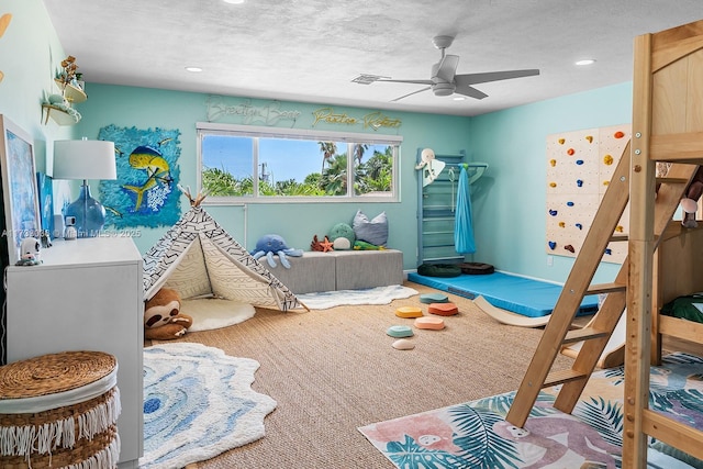 bedroom featuring a ceiling fan, a textured ceiling, and recessed lighting