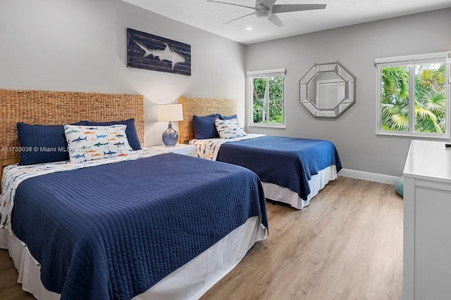 bedroom with light wood finished floors, baseboards, recessed lighting, and ceiling fan
