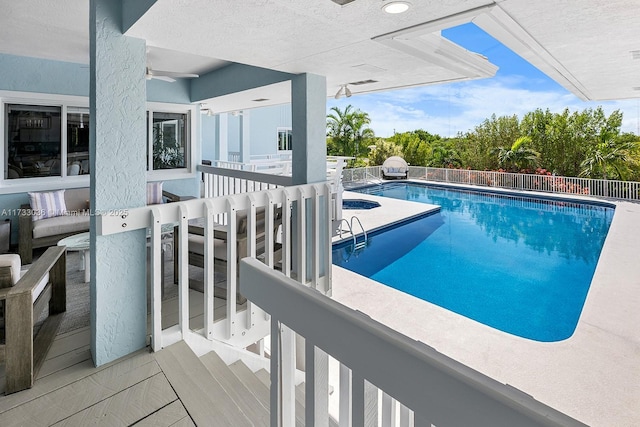 view of swimming pool featuring a fenced in pool