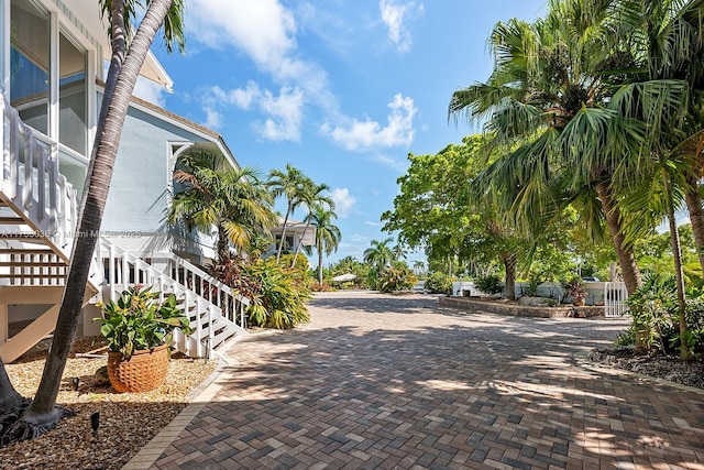 view of property's community featuring stairs