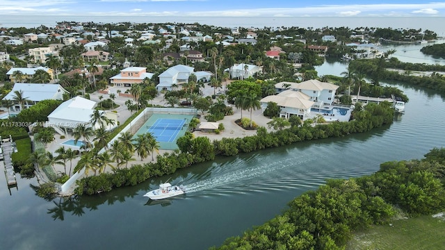 bird's eye view with a water view and a residential view